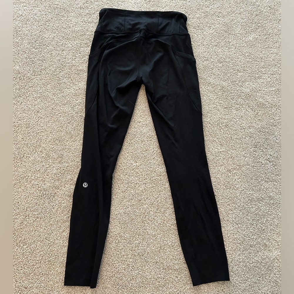 Lululemon Black leggings with pockets size 4. 25 high rise.